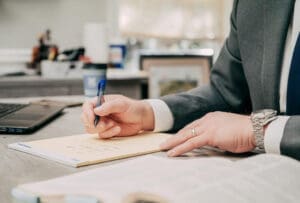 T. Andrew Miller writing on legal pad