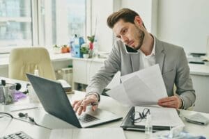 Busy male office worker in formalware