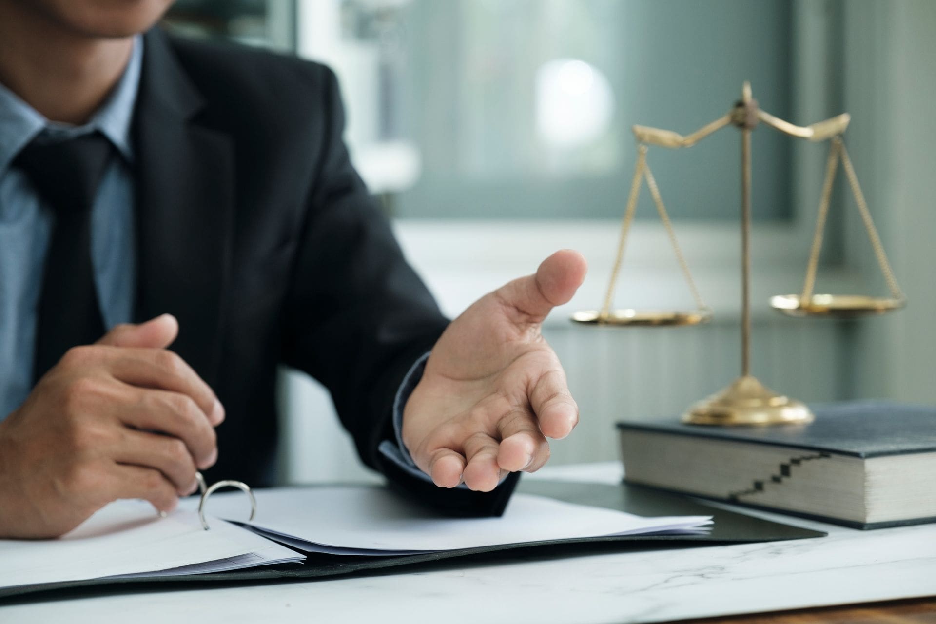 male-lawyer-in-the-office-with-brass-scale GA Workers' Compensation